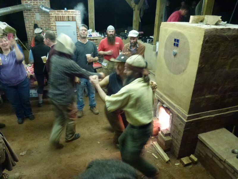 Lasse Holmes and Leslie Jackson dancing in front of the heater